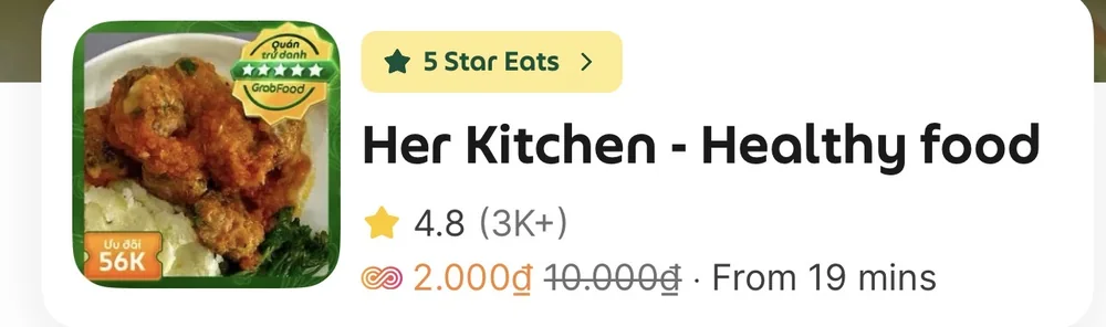 The Her Kitchen listing on Grab, with a plate of meatballs on mash